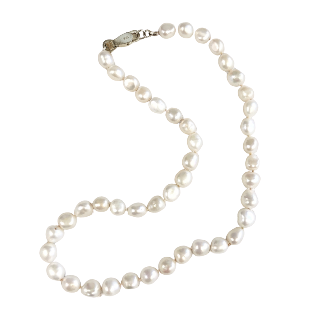 White Pearl Strand on Light Pink Silk